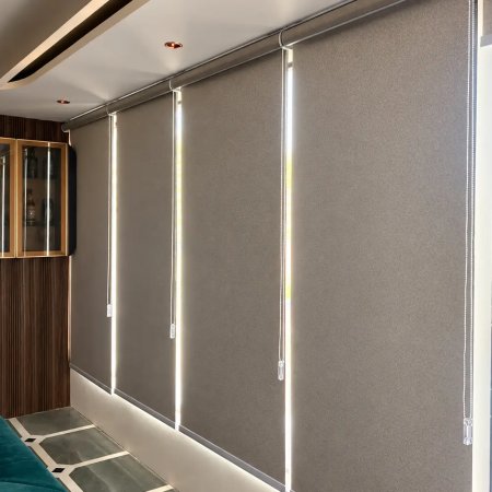 Multiple Roller Blinds Lined Up Across Windows