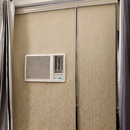 Roller Blind Installed Near Wall AC Unit